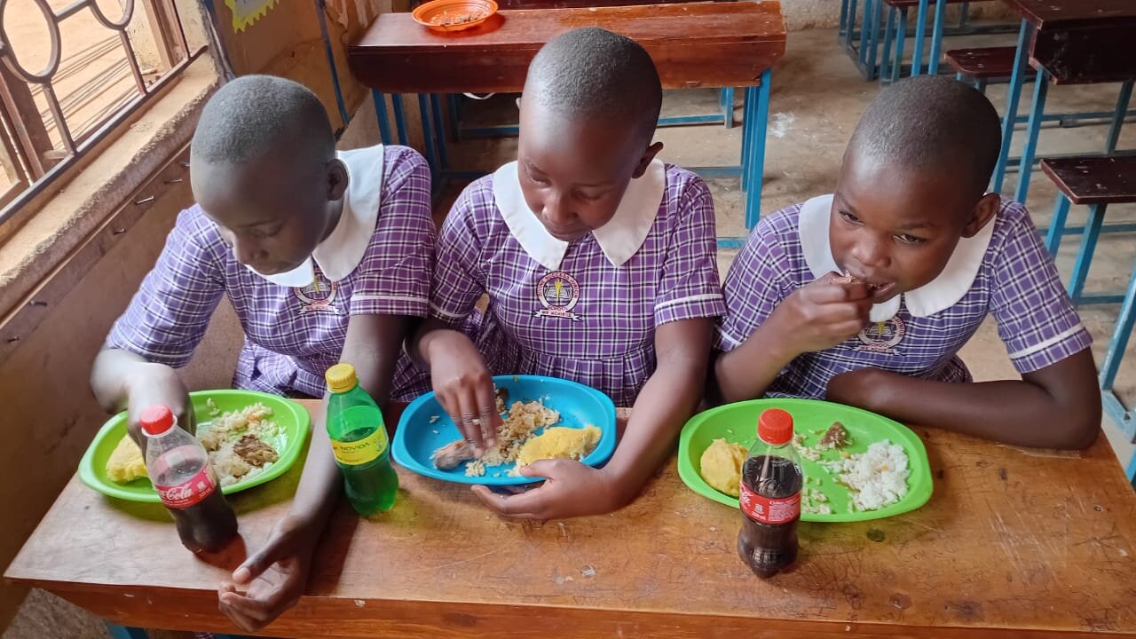 Pupils enjoying a nutritious meal at Divine Success Nursery and Junior School