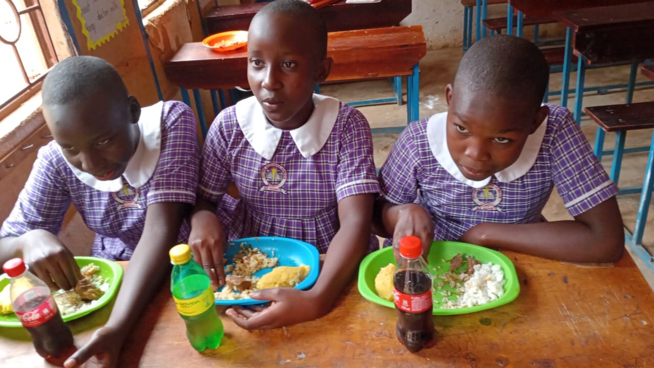 Students sharing a meal at Divine Success Nursery and Junior School